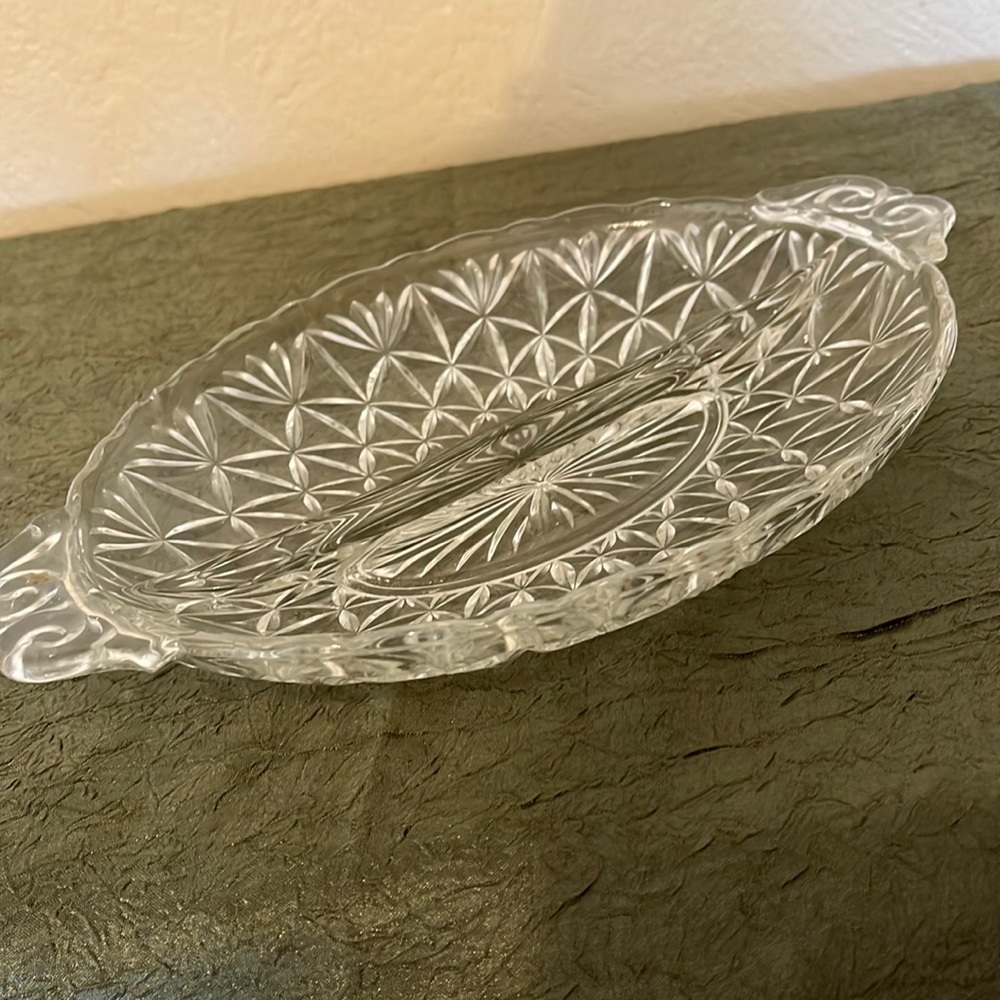 Crystal, cut glass dish, divided with decorative handles, 9”L, 7”W.
